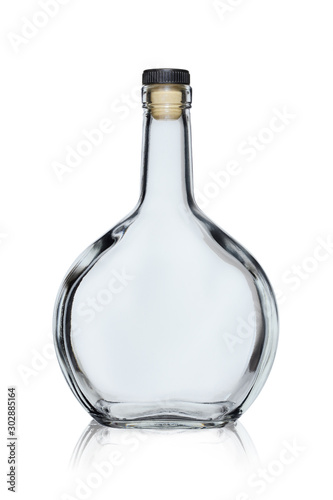Empty glass bottle of rounded shape closed with a cork, isolated on a white background with reflection