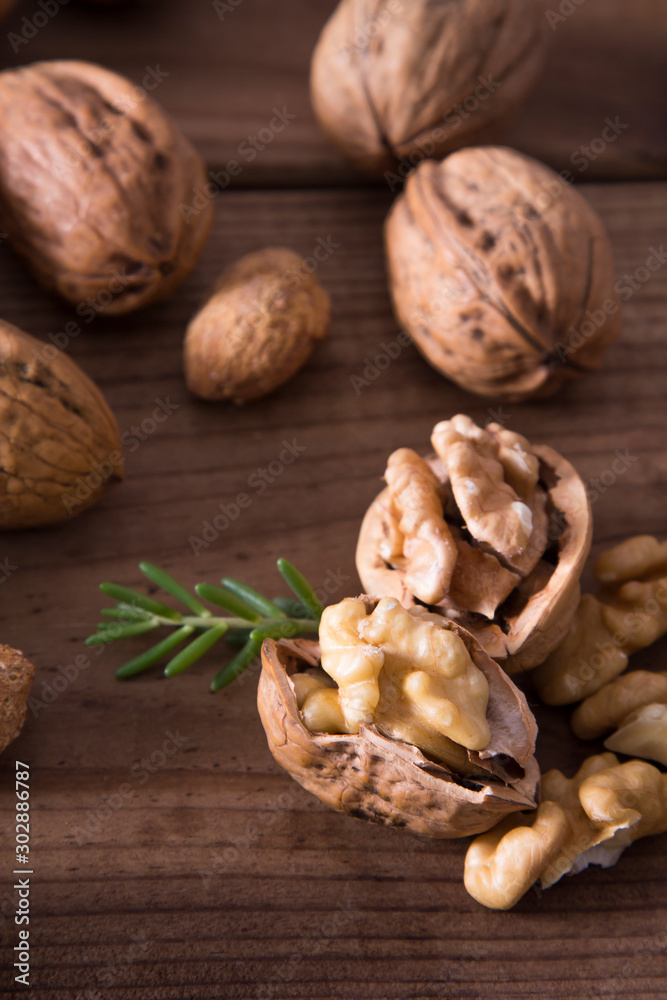 group of nuts on wooden table group of nuts on wooden table