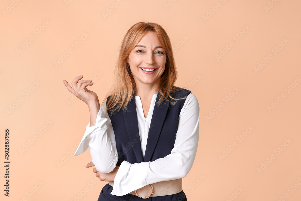 Stylish mature businesswoman on color background Stylish mature businesswoman on color background