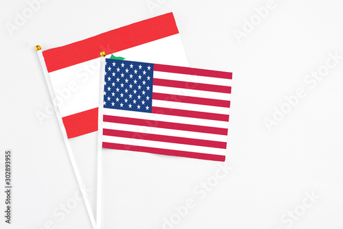 United States and Lebanon stick flags on white background. High quality fabric, miniature national flag. Peaceful global concept.White floor for copy space.