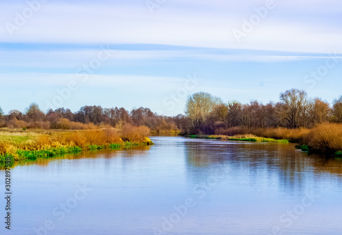 landscape of a beautiful fast river with steep banks