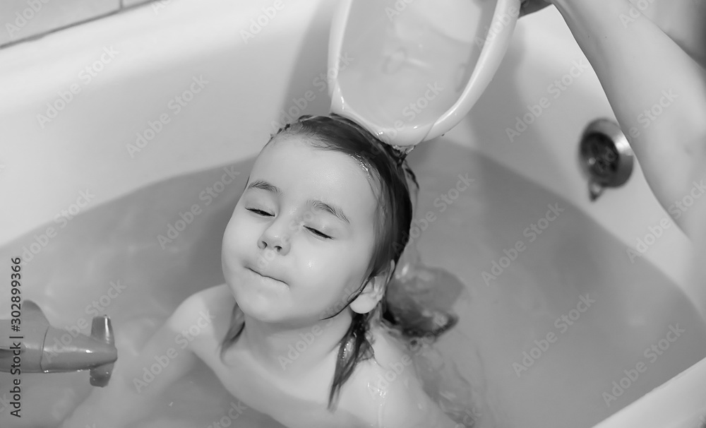 Young children take a bath. Children wash in the bathroom. Brother and