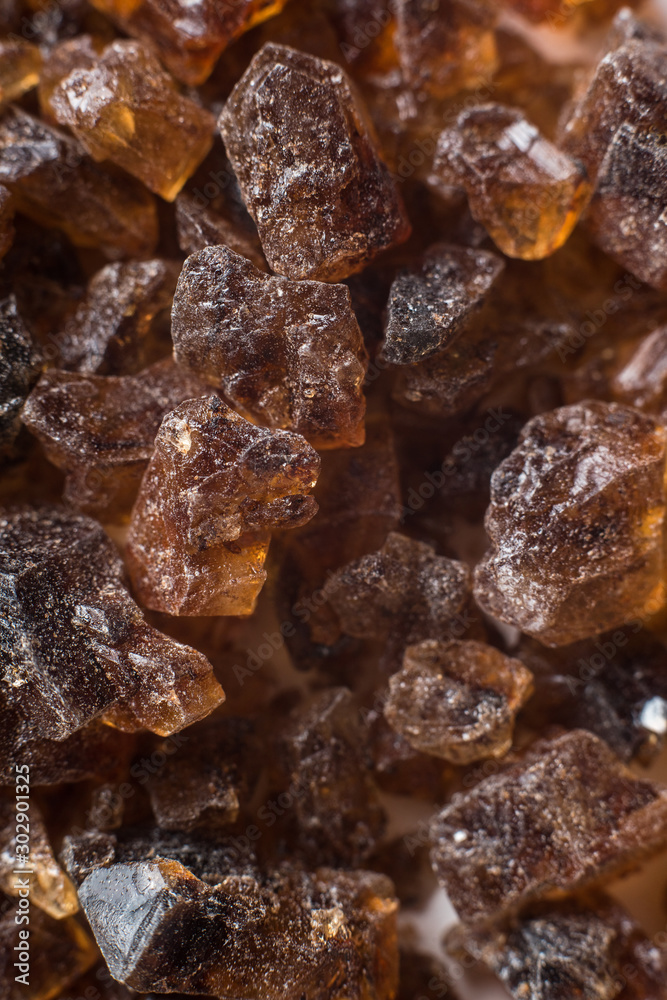 Amber mineral texture as natural background. Sun stones of different sizes, shapes and colors. A lot of big and small diggers. Fossil resin of wood. Material for jewelry. Top view, flat lay Amber mineral texture as natural background. Sun stones of different sizes, shapes and colors. A lot of big and small diggers. Fossil resin of wood. Material for jewelry. Top view, flat lay