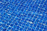 Blue tiles swimming pool, water surface 