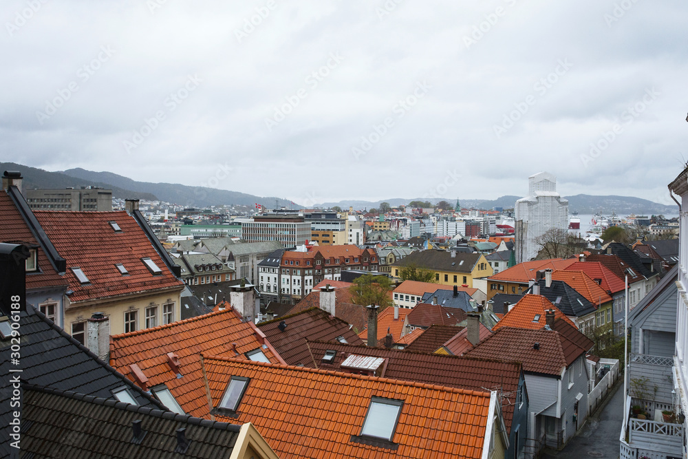 Bergen, Norway cityscape with colorful traditional houses roofs from terracotta tiles