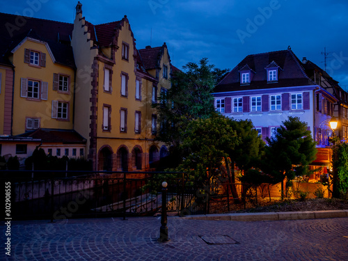 Architecture and residential buildings on the canal of the old city at night, Colmar © Maxim