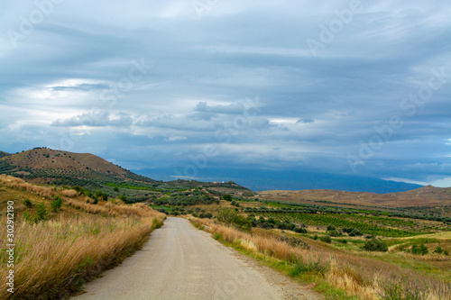 Scenic small mountain road with beautiful views between villages in eastern part of Sicily island, Italy