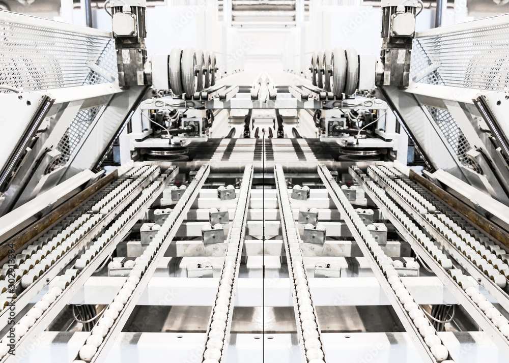 Whitened collage of typical feed line, conveyor belt with rollers and supports. Industrial background. Modern production equipment. Selective focus. Copy space. Whitened collage of typical feed line, conveyor belt with rollers and supports. Industrial background. Modern production equipment. Selective focus. Copy space.