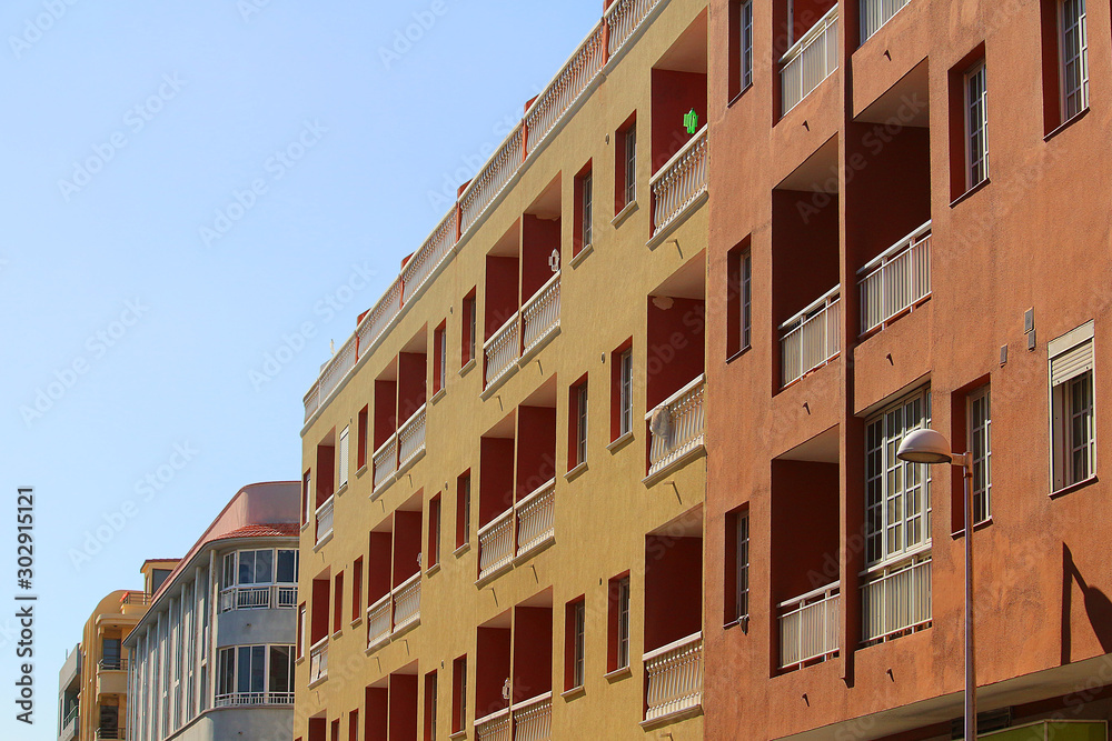 Contemporary colorful apartment buildings in Spanish style (El Medano, Tenerife)