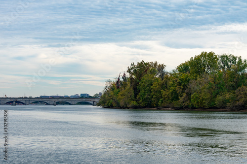 Trees along the Shore of Arlington Virginia next to a Bridge over the Potomac River to Washington D.C. © James