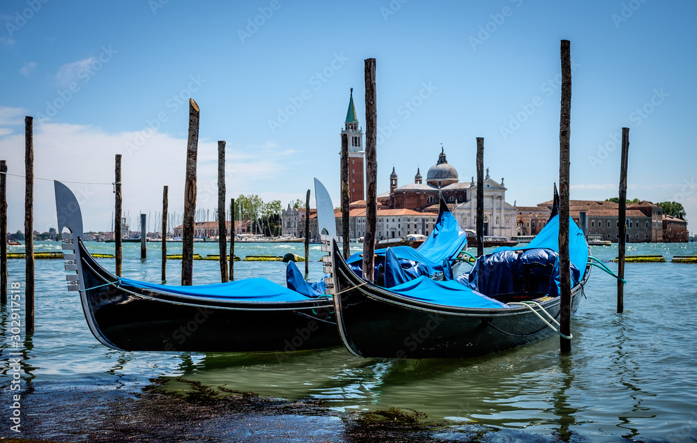 Gondolas on Docks in Grand Canal, Venice Italy