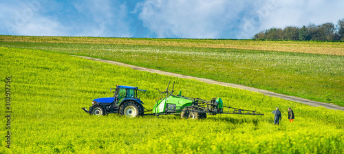 farmer spraying his fields in autumn