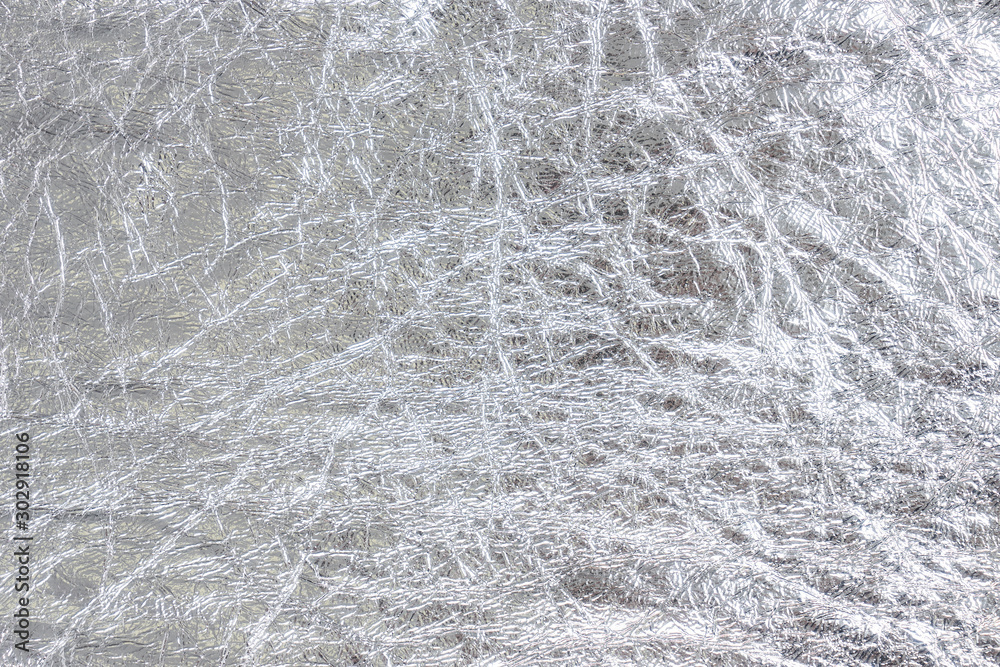 Crumpled silver foil texture. Sheet of rough metal decorative material.  Shiny abstract backdrop. Stock Photo | Adobe Stock