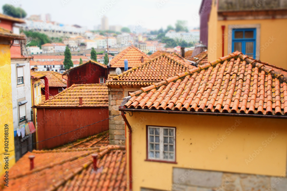 Roofs of old houses from red tiles, bright walls and windows. Roofs of old houses from red tiles, bright walls and windows.