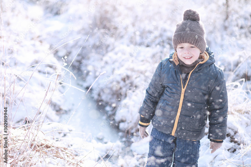 Kids walk in the park first snow Kids walk in the park first snow
