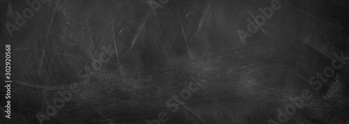 Abstract texture of chalk rubbed out on horizontal blackboard or chalkboard, concept for education, back to school, startup, teaching , etc.