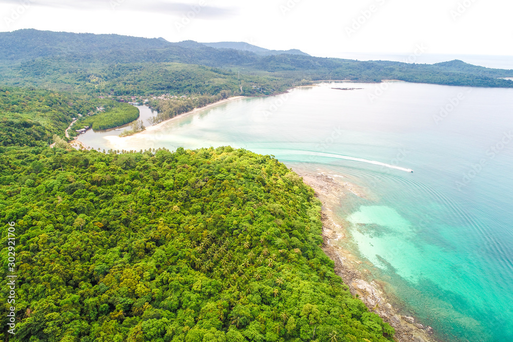 Tropical rainforest sea beach with mountain of palm tree