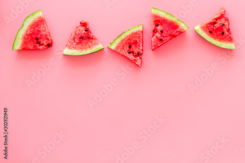 Slices of watermelon on pink background top view mock up