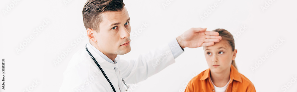 panoramic shot of pediatrist in white coat taking temperature of child isolated on white panoramic shot of pediatrist in white coat taking temperature of child isolated on white