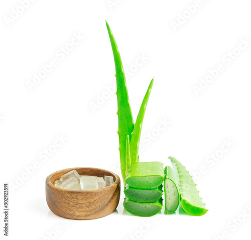 Aloe vera  leaf cut sliced and cut cube in wooden bowlisolated on white background. High benefit as an herb with medicinal properties photo