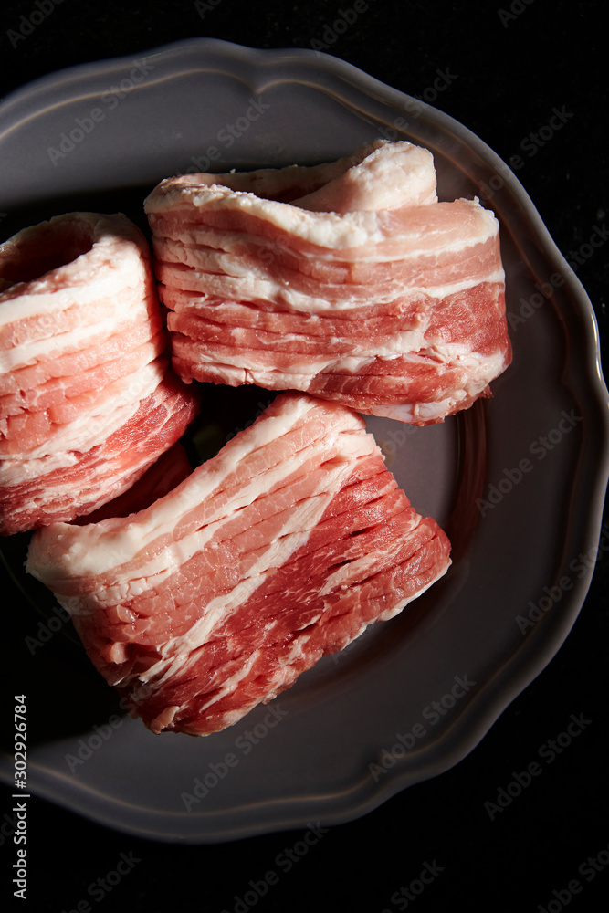 Fresh raw pork belly on plate