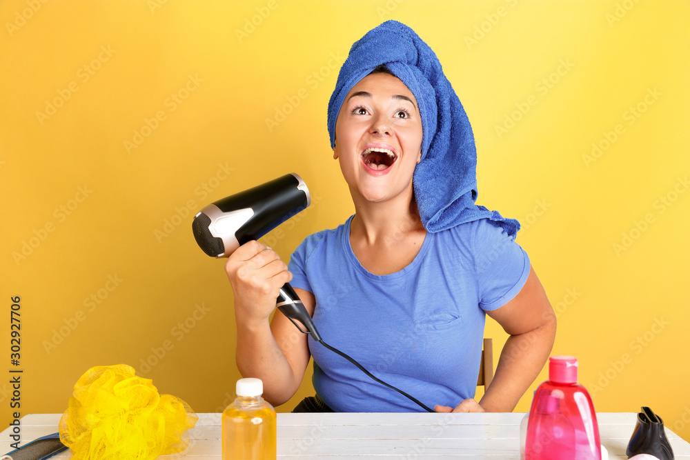 Portrait of young caucasian woman in her beauty day, skin and hair care routine. Female model with natural cosmetics applying cream and oils for make up. Body and face care, natural beauty concept. Portrait of young caucasian woman in her beauty day, skin and hair care routine. Female model with natural cosmetics applying cream and oils for make up. Body and face care, natural beauty concept.