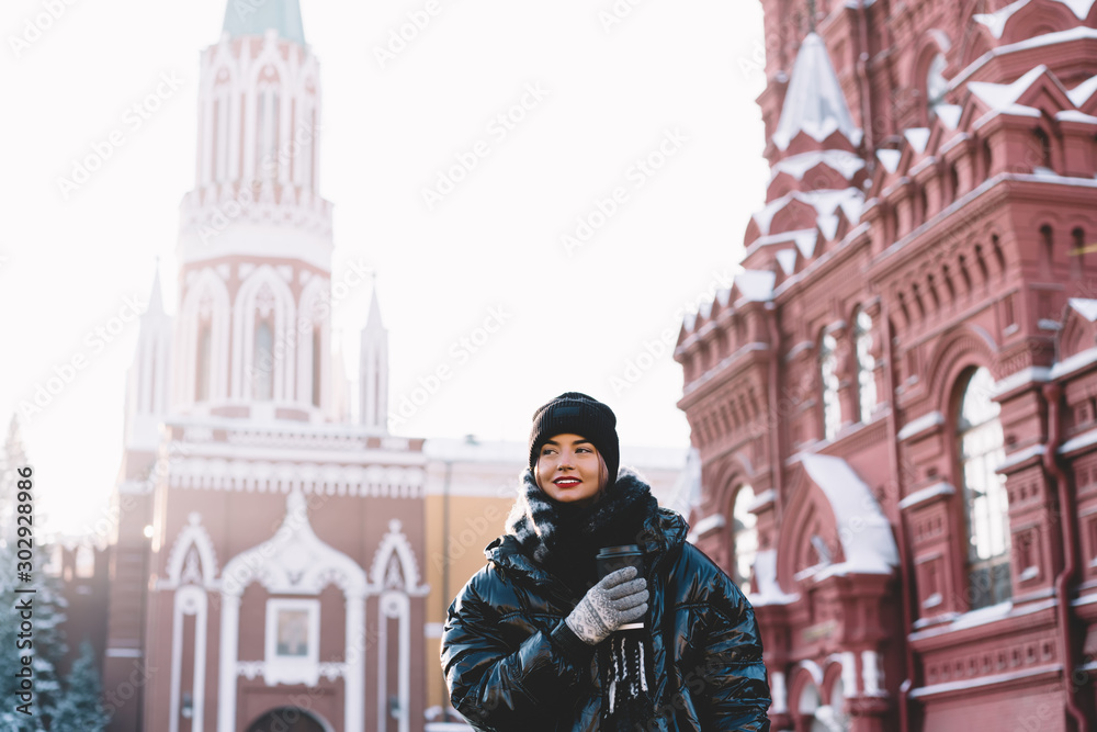 Attractive female in warm jacket with hot drink Attractive female in warm jacket with hot drink