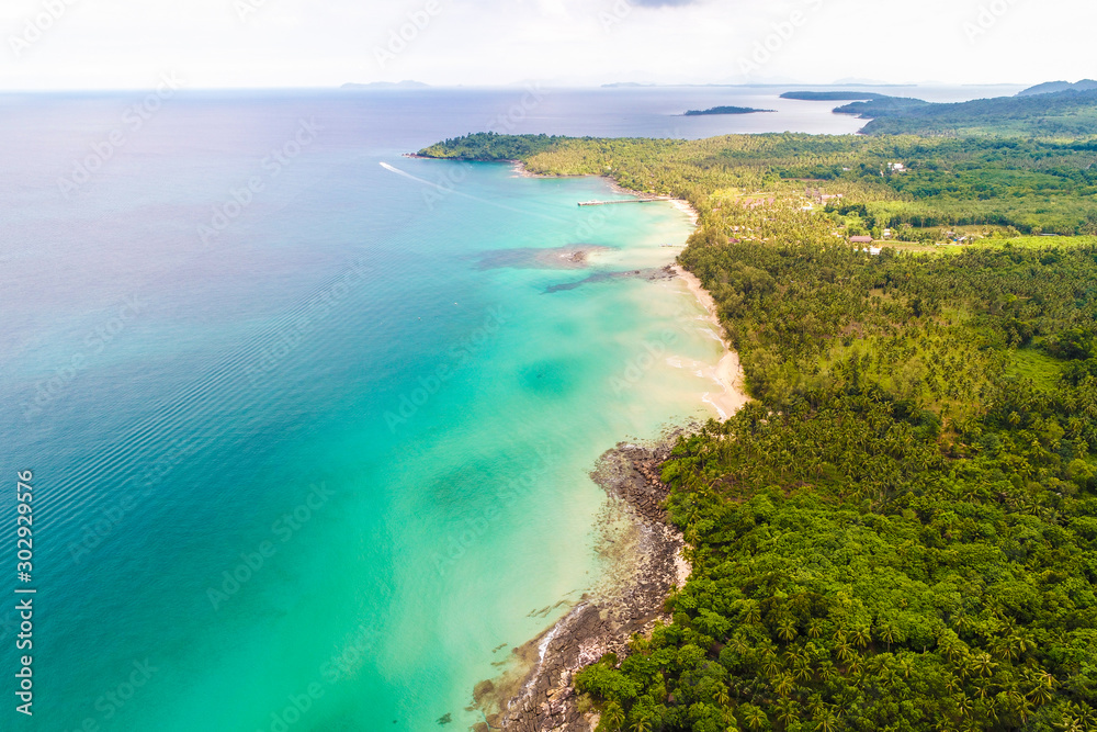 Tropical rainforest sea beach with mountain of palm tree