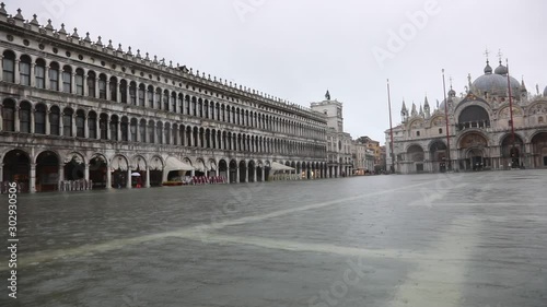 Basilica of Saint Mark in Main Square of Venice Island with water during the flood photo