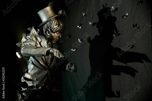 Tablou pe pânză Side view of professional mime performing at pantomime act
