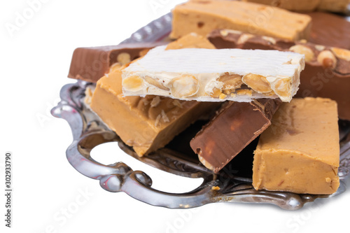 assorted nougat in tray isolated on white