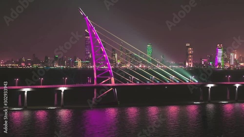 The Sheikh Jaber Al-Ahmed Al-Sabah Bridge is a road bridge in Kuwait over the Gulf of Kuwait, part of the Persian Gulf. Night aerial view. photo