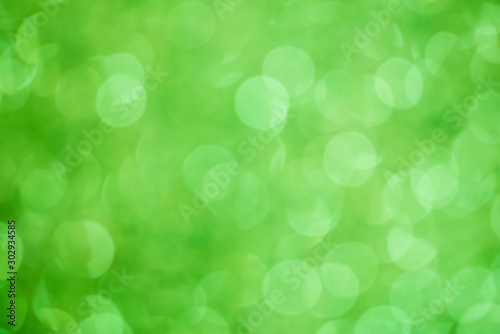abstract blur or defocused lights bokeh on green background