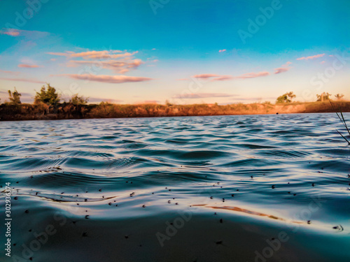 Fototapeta Naklejka Na Ścianę i Meble -  Beautiful sky water sunset over the lake
