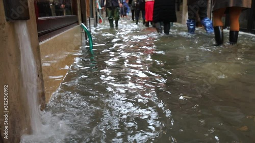 Narrow street called CALLE in italian language of Venice during Flood in Italy