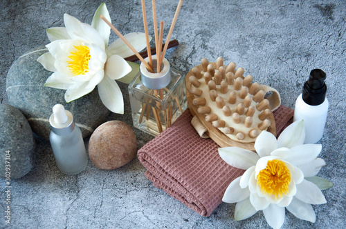 Body care ingredients and accessories. Asian culture and medicine. Natural oils, aromatherapy, stone massage. Water lily flower with body therapy.