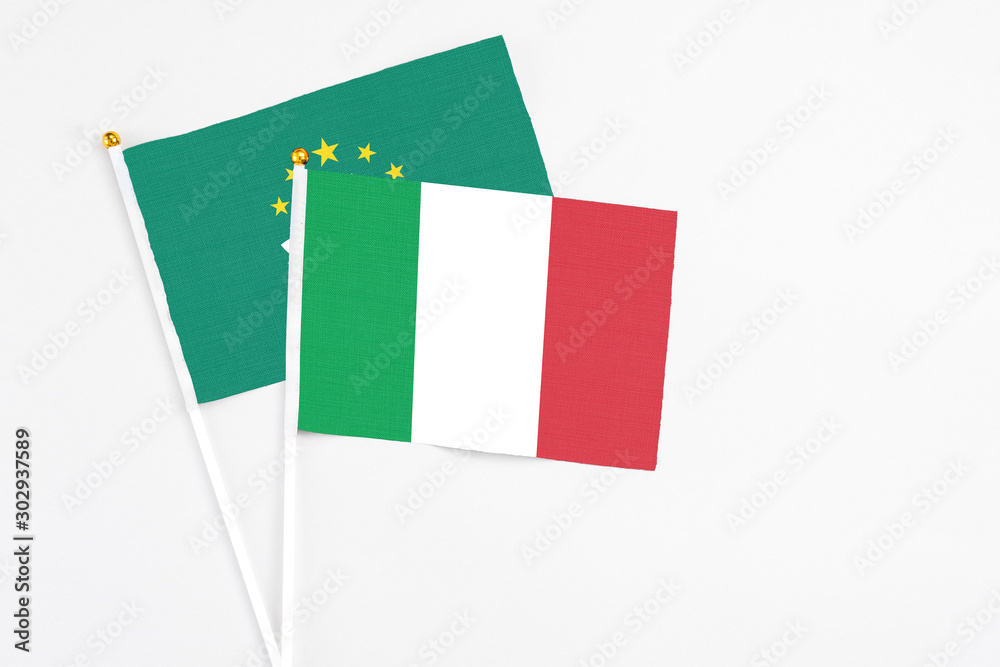 Fototapeta premium Italy and Macao stick flags on white background. High quality fabric, miniature national flag. Peaceful global concept.White floor for copy space.