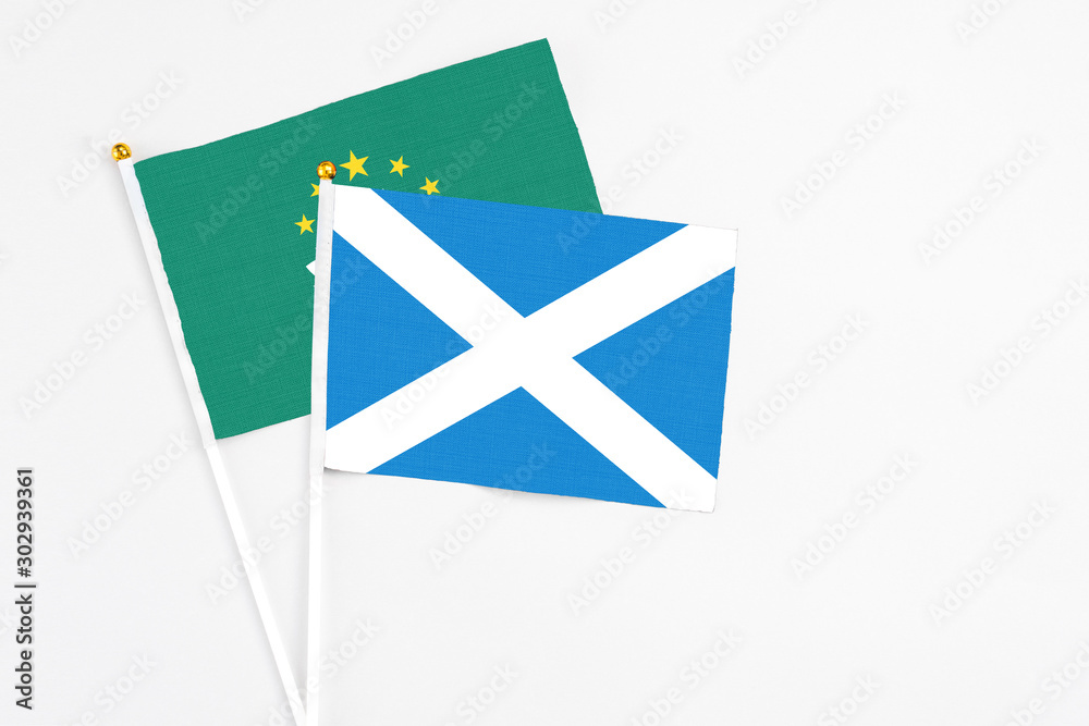 Scotland and Macao stick flags on white background. High quality fabric, miniature national flag. Peaceful global concept.White floor for copy space. Scotland and Macao stick flags on white background. High quality fabric, miniature national flag. Peaceful global concept.White floor for copy space.