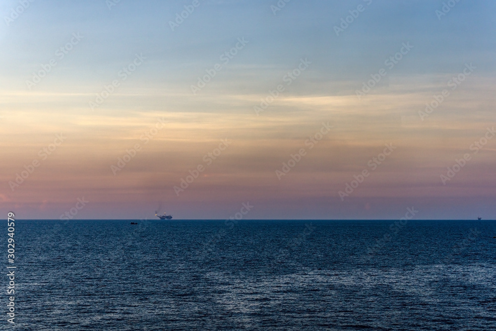 Landscape or seascape of an oil field