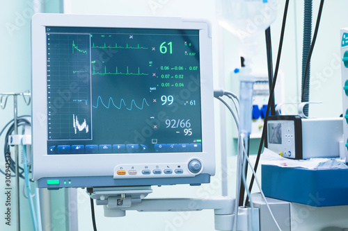 Clinical Hospital. Surgeons monitoring a patient’s cardiogram during an operation.