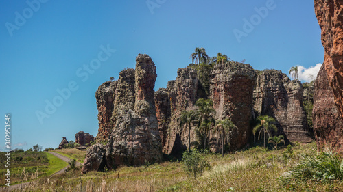 Sandstone geological monuments (Arenitos) in Vila Velha State Park, with local road on background - Ponta Grossa, Paraná, Brazil
