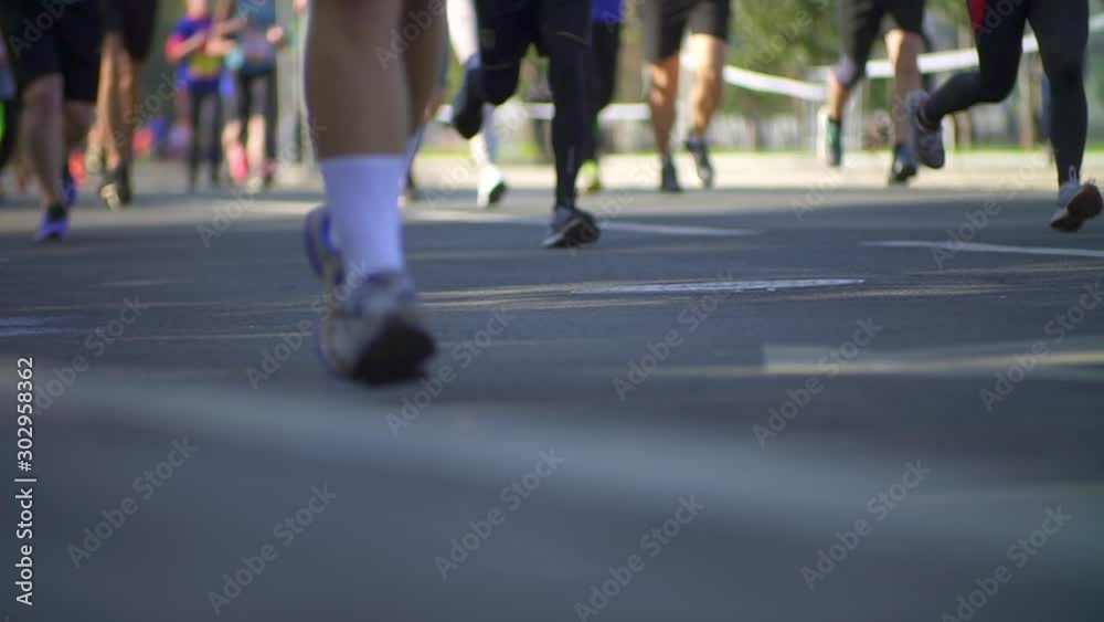 Hundreds of people run in a sports marathon