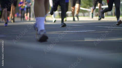 Hundreds of people run in a sports marathon