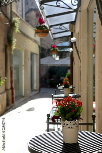 Flowers and tables in a picturesque alley in central Split, Croatia. 
