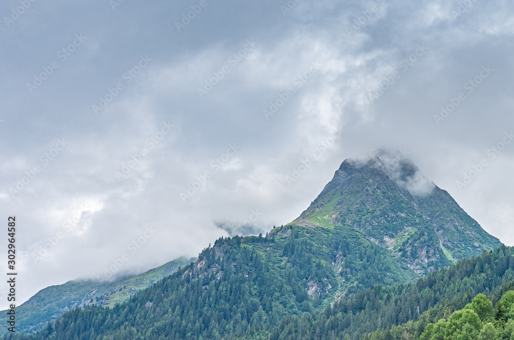 mountain in the clouds in montafon silvretta in the austrian alps, austria