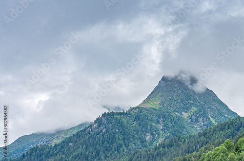 mountain in the clouds in montafon silvretta in the austrian alps, austria