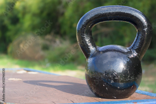 Kettlebell on a bench outdoors