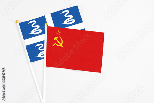 Soviet Union and Martinique stick flags on white background. High quality fabric, miniature national flag. Peaceful global concept.White floor for copy space.
