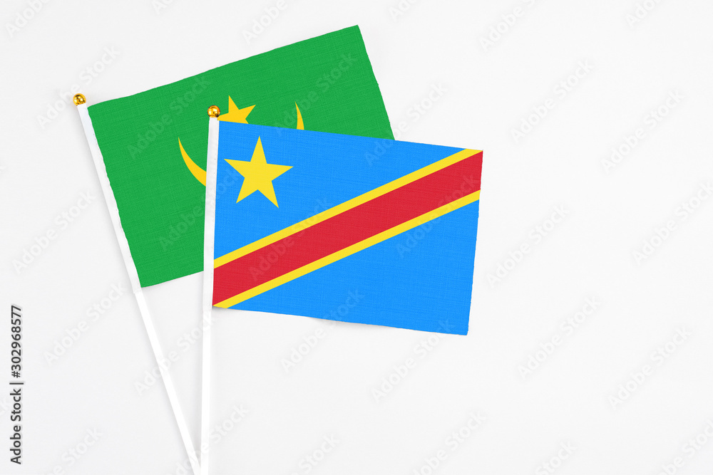 Congo and Mauritania stick flags on white background. High quality fabric, miniature national flag. Peaceful global concept.White floor for copy space. Congo and Mauritania stick flags on white background. High quality fabric, miniature national flag. Peaceful global concept.White floor for copy space.