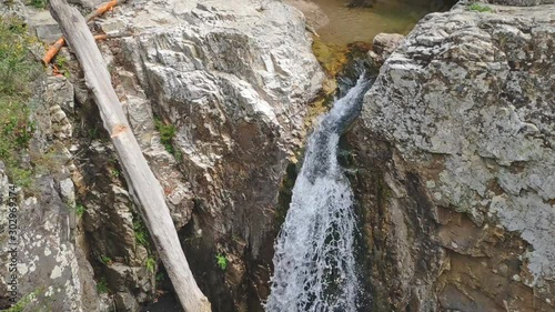 Amazing Cehennem waterfall falling, hitting surface photo